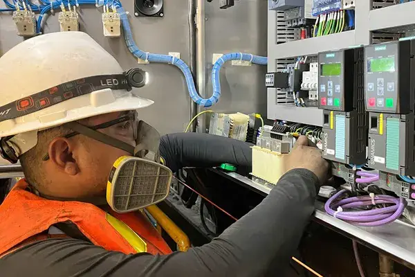 Operator doing preventive maintenance in a factory
